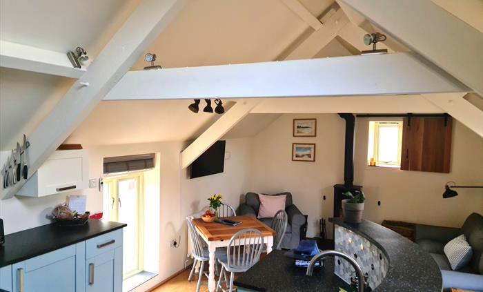 The Living Area of the Mill House: Kitchen, dining and seating areas.